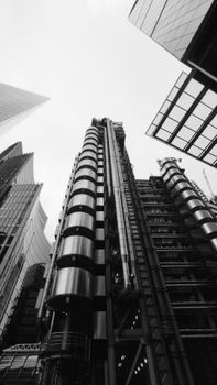 Low angle view of the architectural marvel Lloyd's Building in London's financial district.
