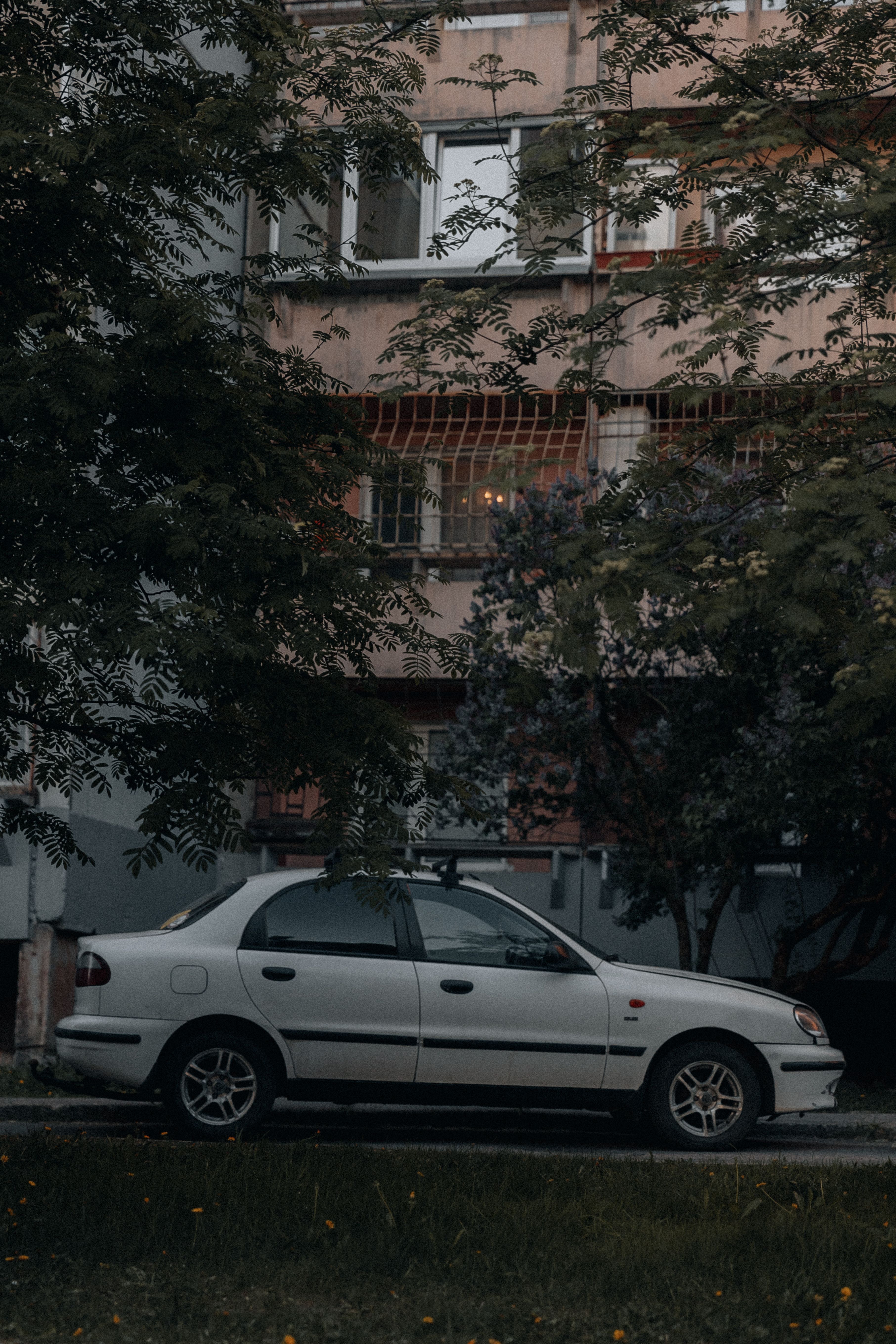 Car Parked in front of a Building · Free Stock Photo