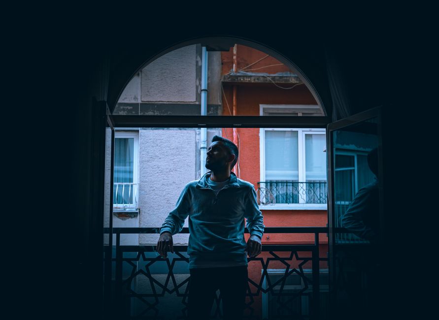 Person looking thoughtfully from balcony - EMDR for PTSD Person looking thoughtfully from balcony - EMDR for PTSD