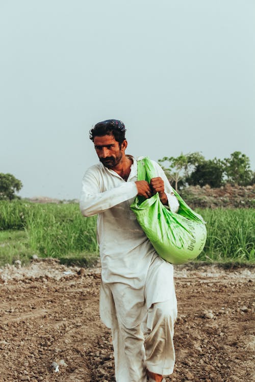 Man Carrying a Bag 