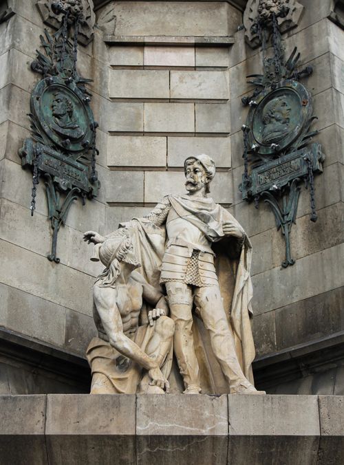 Free Statues on a historic building in Barcelona. Intricate architecture visible. Stock Photo