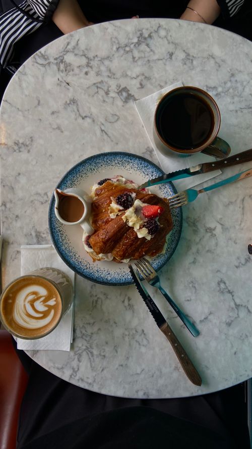 Free Top view of a gourmet breakfast table with coffee and a fruity pastry, shot in İstanbul. Stock Photo
