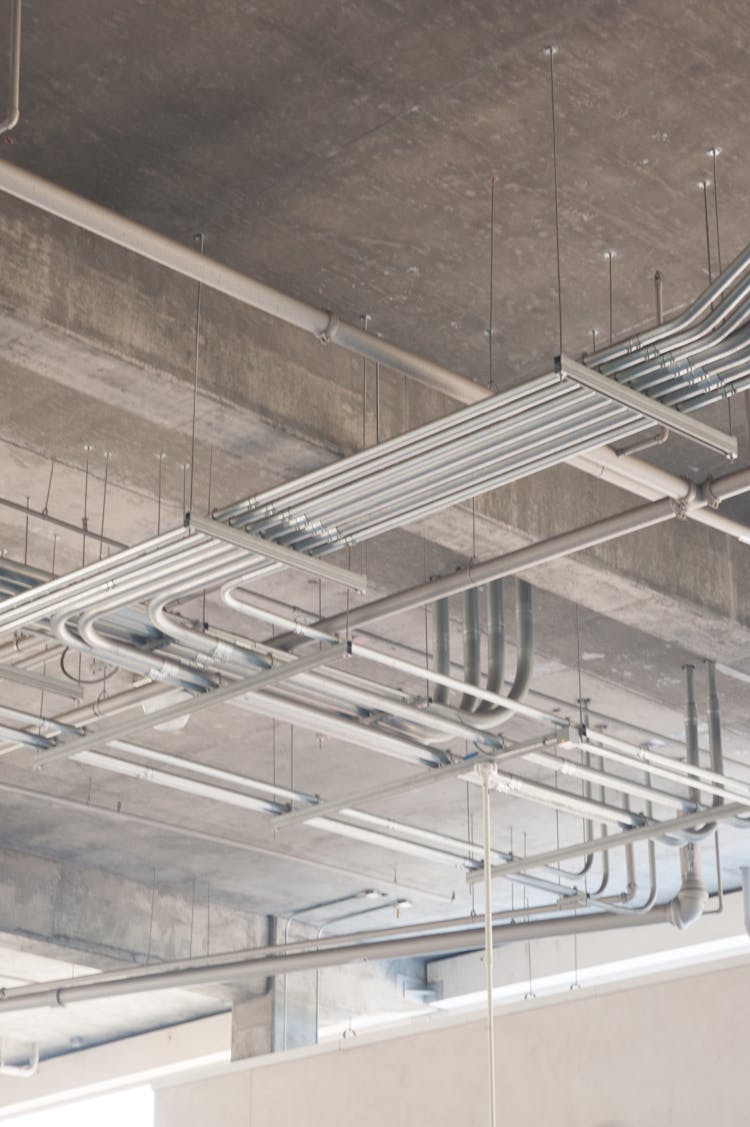 Metal Pipes Hanging Under Ceiling