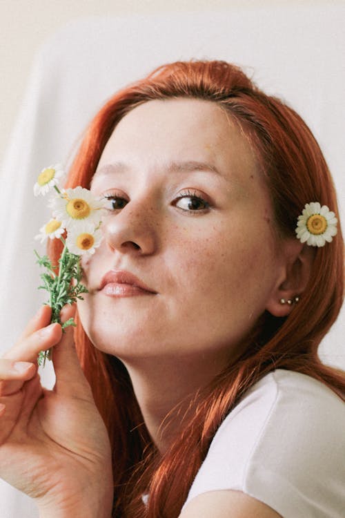 Redhead Woman with Chamomile Flowers