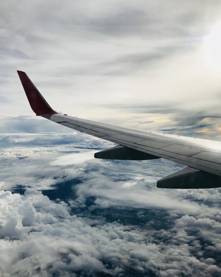 Grey And Red Airliner Wing