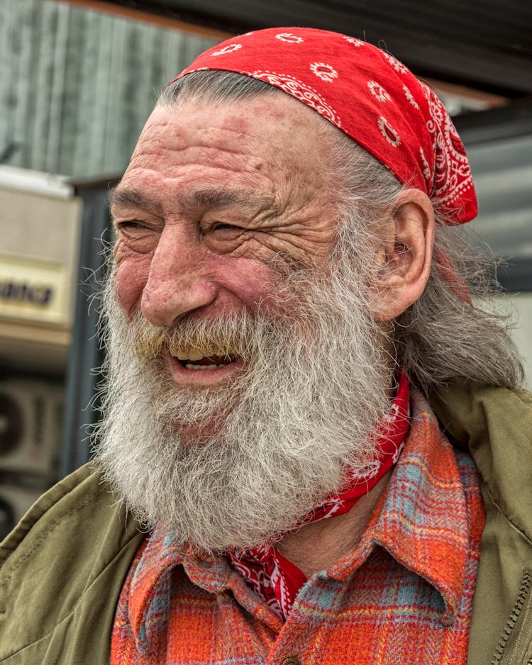 Candid Portrait Of An Elderly Man With A Long Gray Beard 