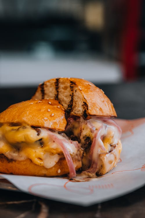 Close-up of a Burger with a Lot of Melted Cheese 