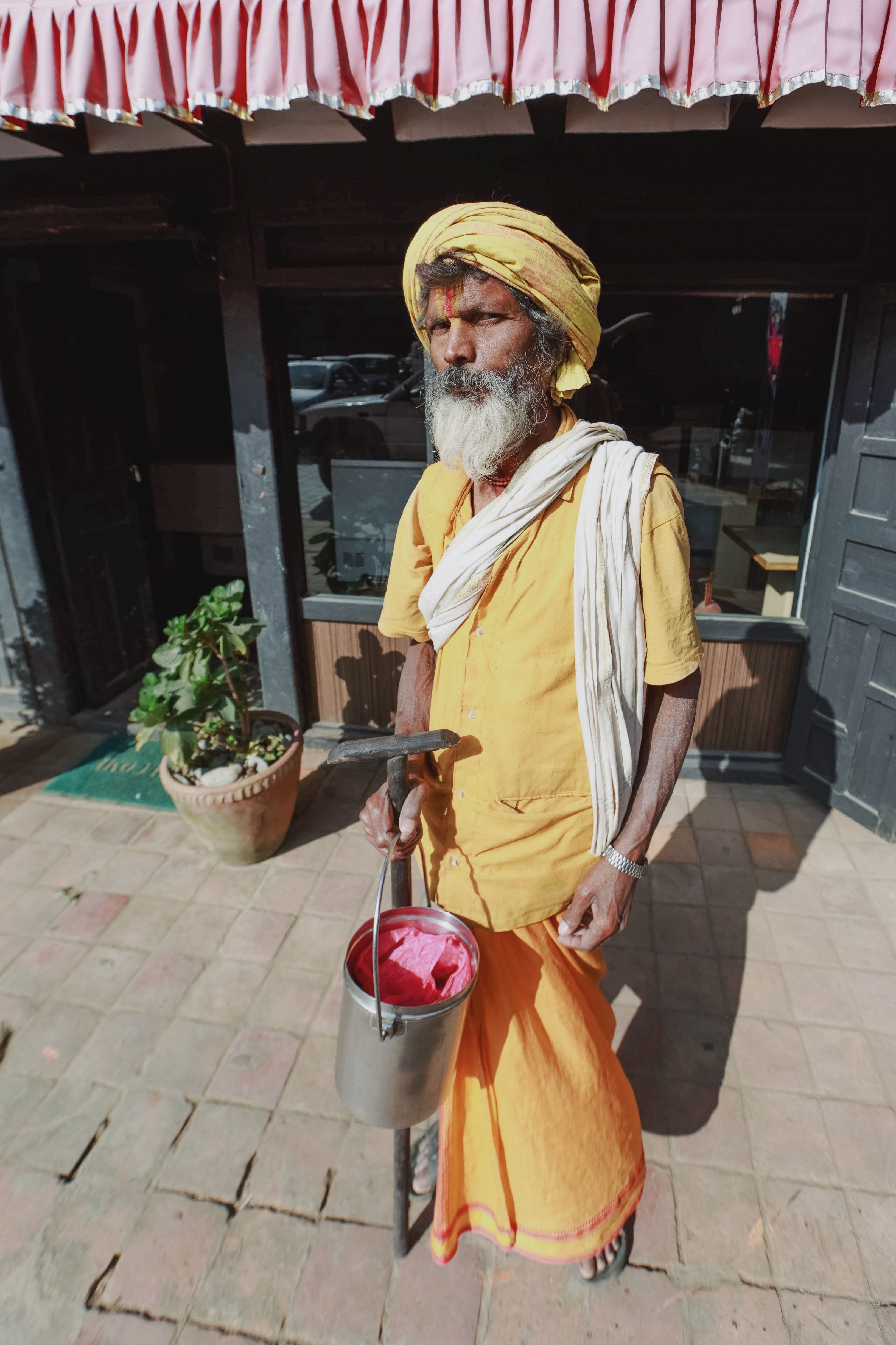 Elderly Man in a Gown and Turban Standing on the Sidewalk · Free Stock ...