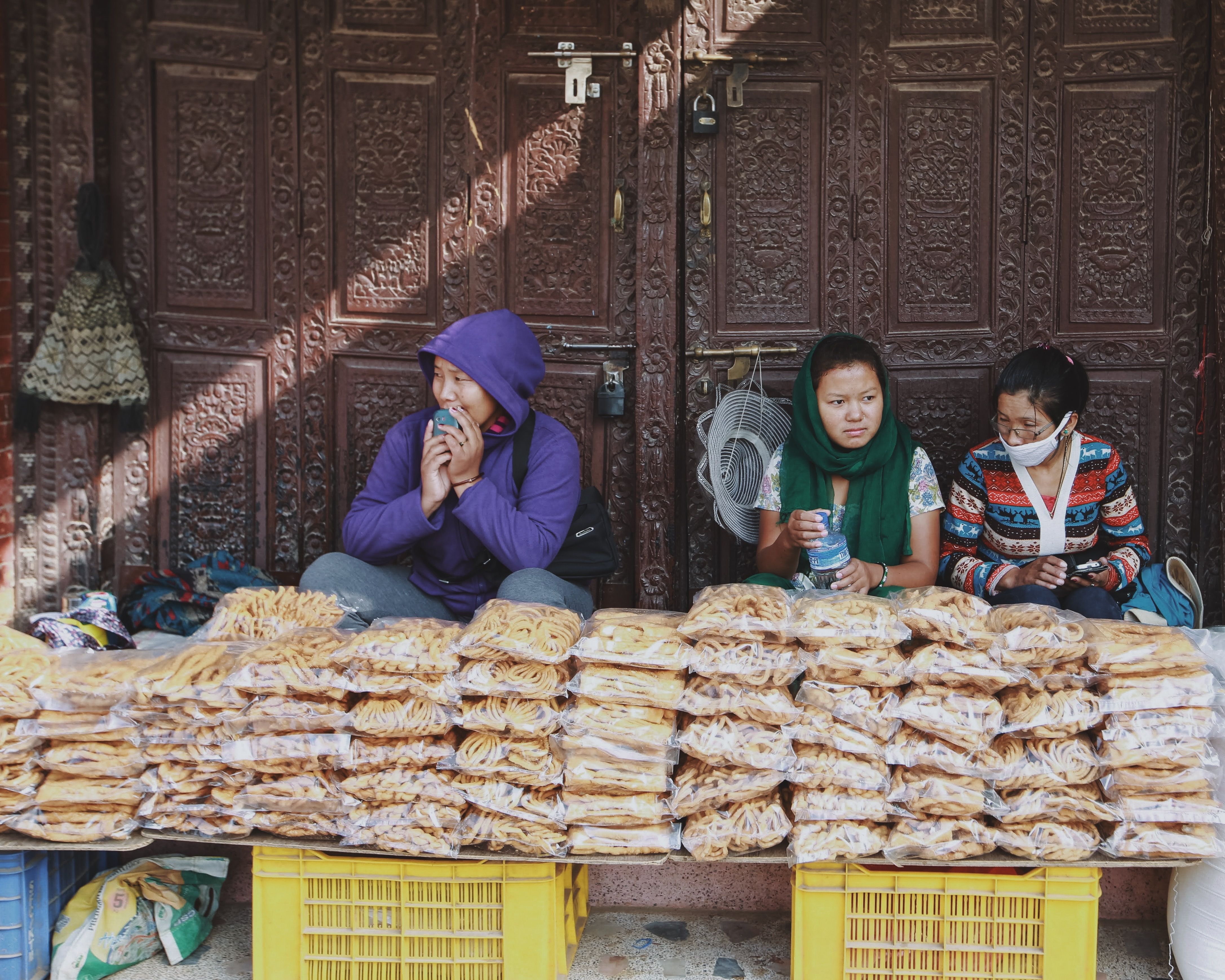 Korean street vendor selling beondegi (silkworm pupae) from a cart or stall.