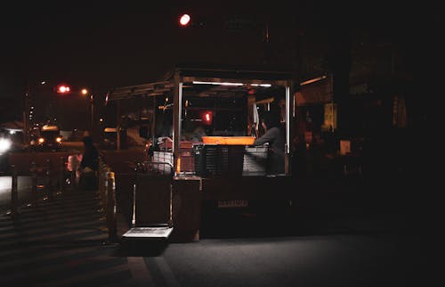 Free Illuminated Market Stall on the Street in City at Night  Stock Photo