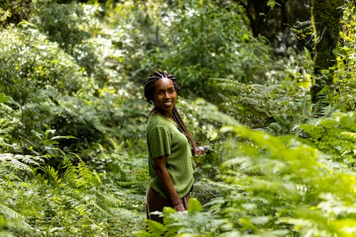 Free Smiling Woman in Deep Forest Stock Photo