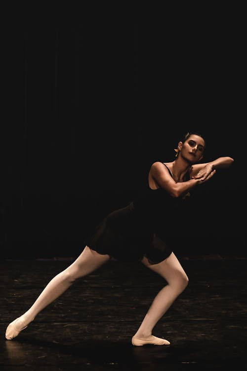 Ballerina in a Black Leotard During a Performance