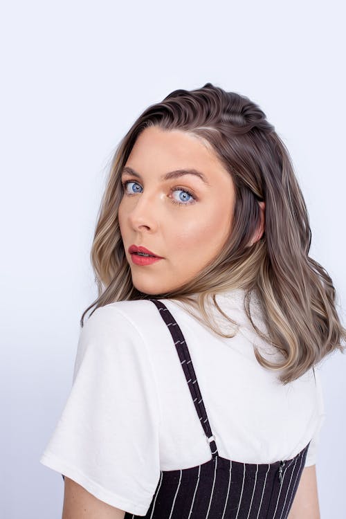 Studio Shot of a Young Woman Looking over Shoulder 