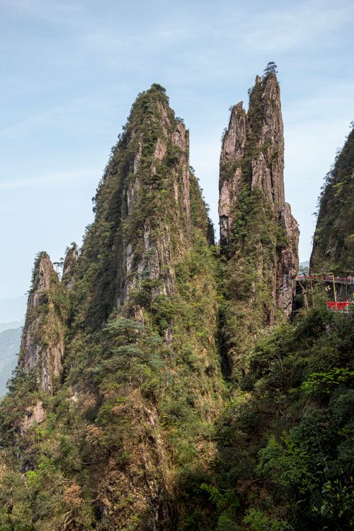 Free Stunning vertical rock formations covered in lush greenery, creating a picturesque landscape. Stock Photo