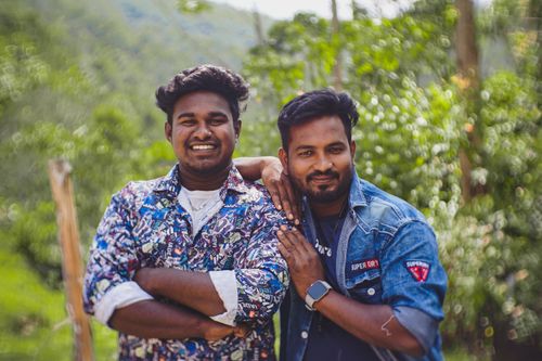 Free Two adult men smiling and posing together outdoors, showcasing friendship and joy. Stock Photo