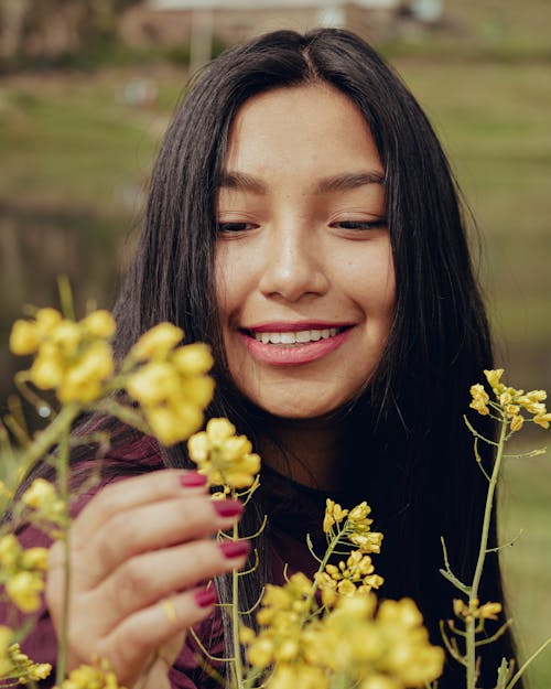 Smiling, Brunette Woman with Flowers