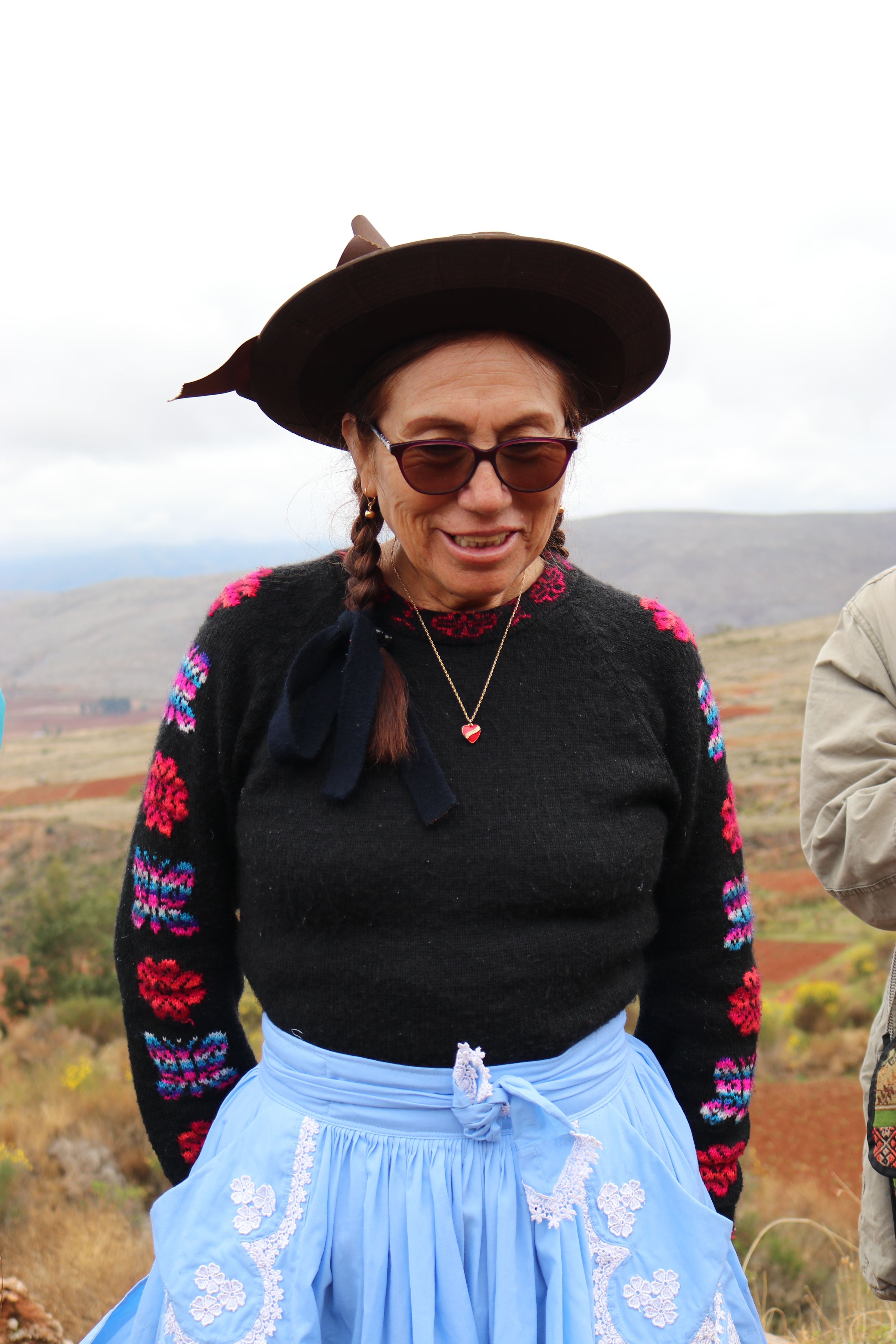 Woman in traditional clothing outdoors in Huancayo, Peru, showcasing cultural attire.