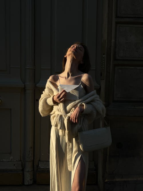 Woman Posing in Coat and with Bag