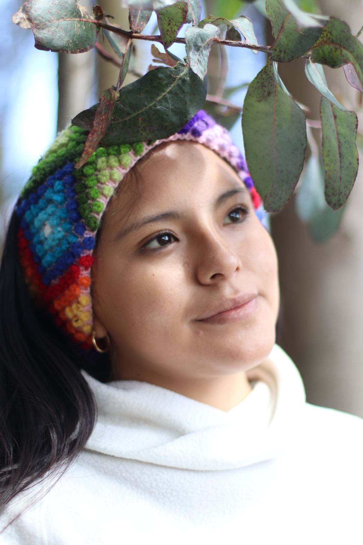 Yarn craft ideas with a colourful yarn headband worn by a woman