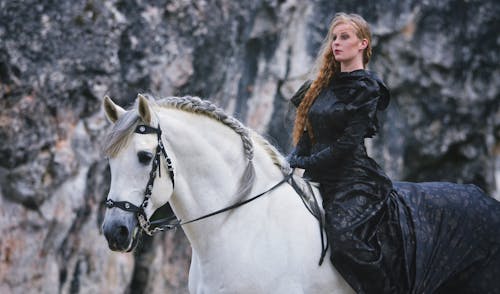 Blonde in Black Dress on White Horse 