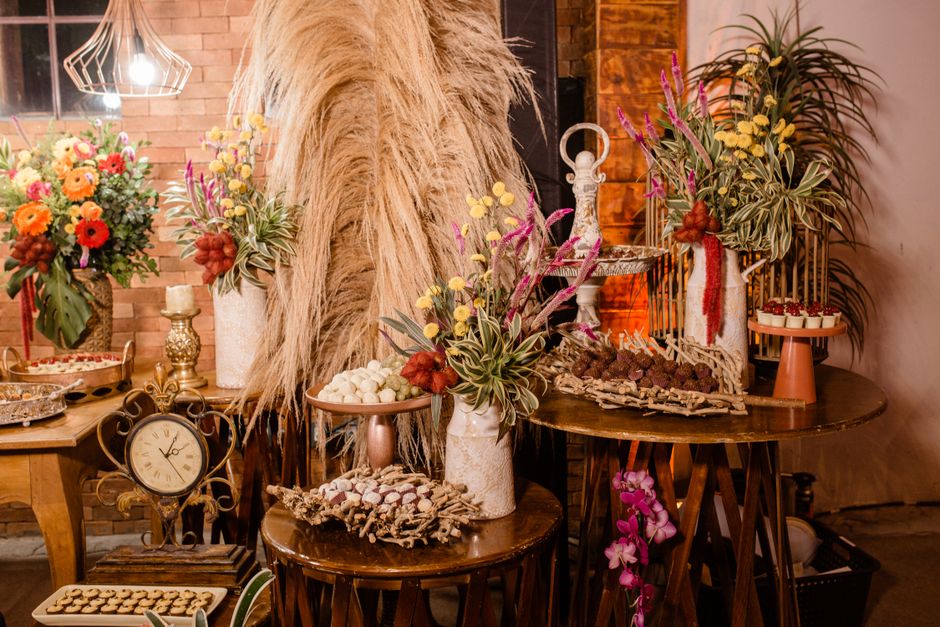 Charming rustic décor with vibrant floral arrangements and wooden tables, perfect for home interiors.