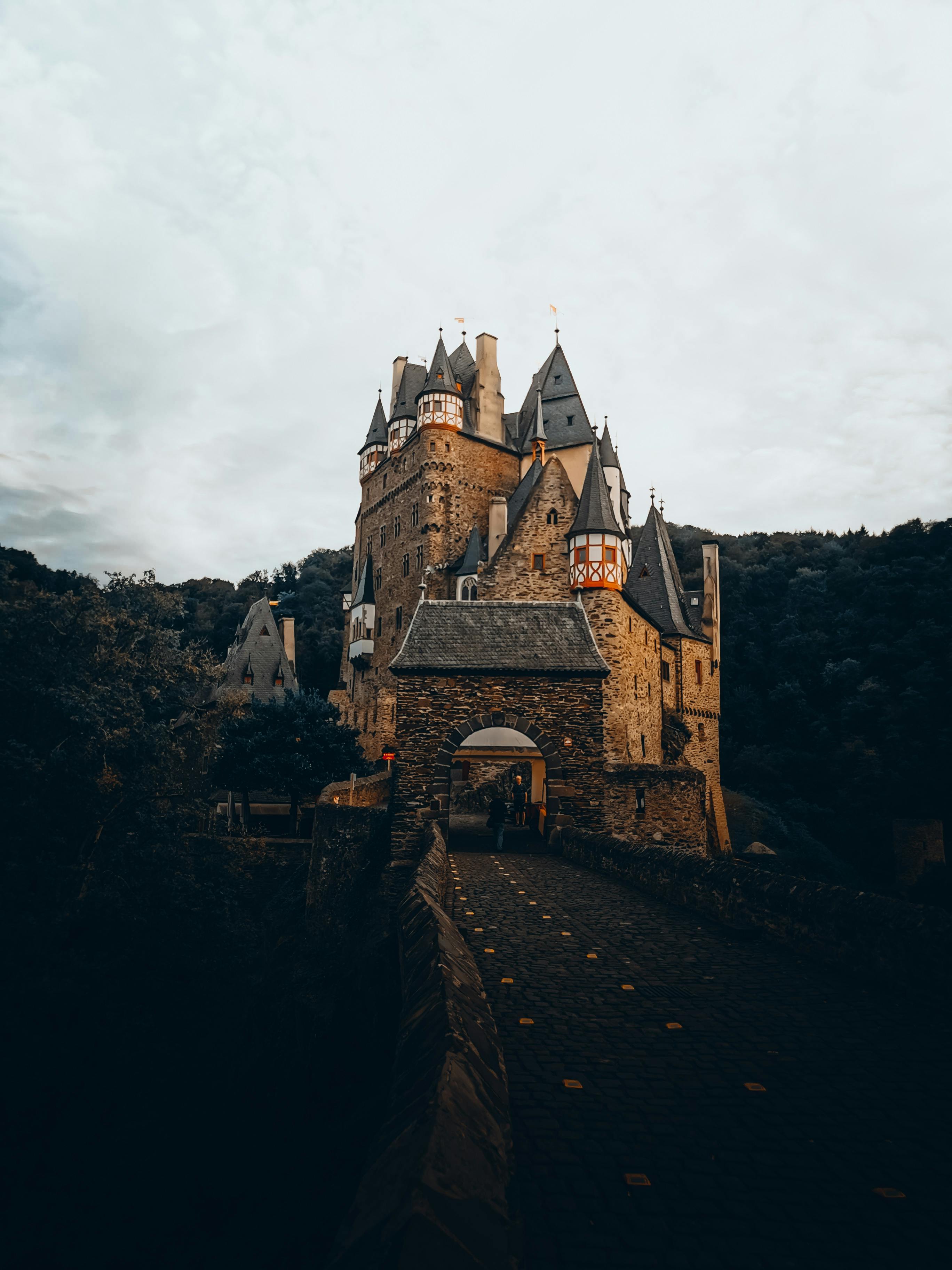 Explore the medieval charm of Eltz Castle in Wierschem, Germany, surrounded by lush forests.