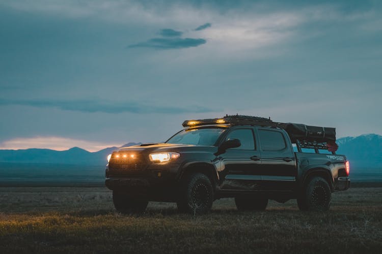 Large Black Car On Wasteland