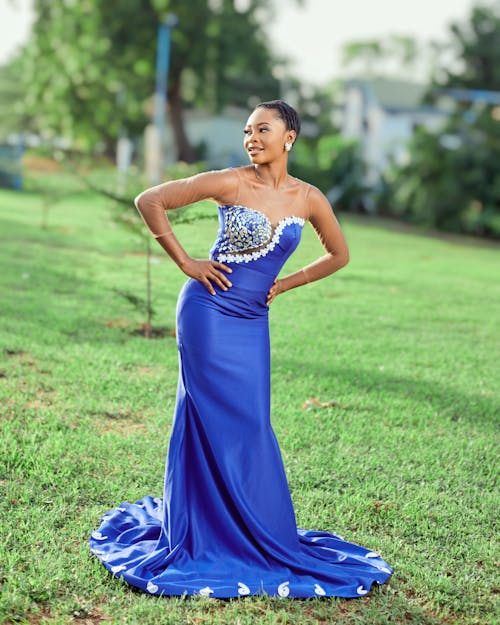 Short Haired Woman in Blue Dress Posing in Park