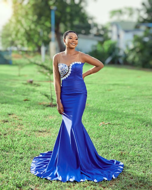 Smiling Woman in Long Blue Dress