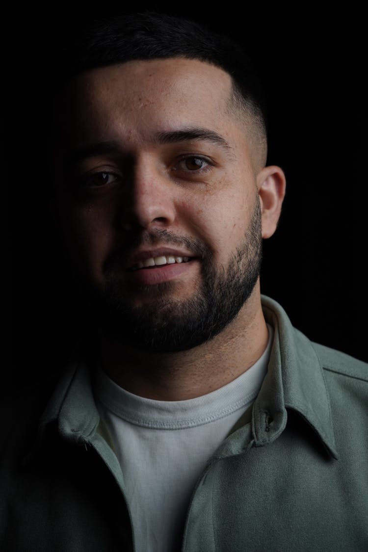 Studio Portrait Of A Bearded Man Smiling 