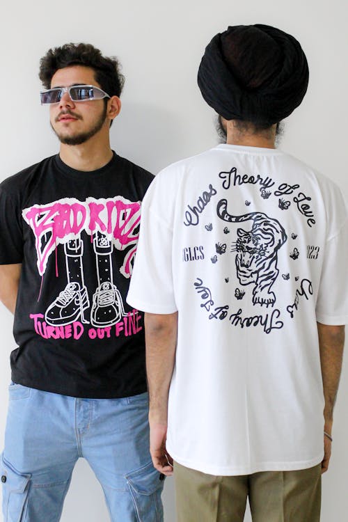 Studio Shot of Two Men Wearing Graphic T-shirts 