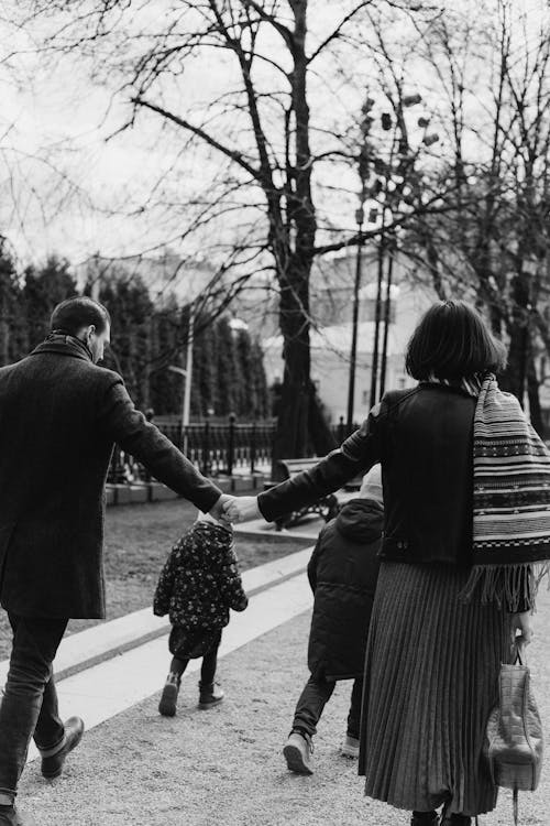 A Family Taking a Walk in Black and White