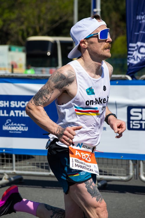 Runner with White Cap During Competition