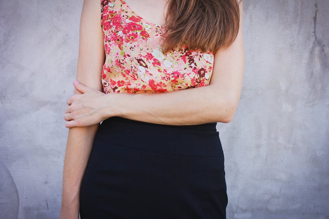 Free Woman Wearing Red and Green Sleeveless Shirt and Black Bottoms Stock Photo