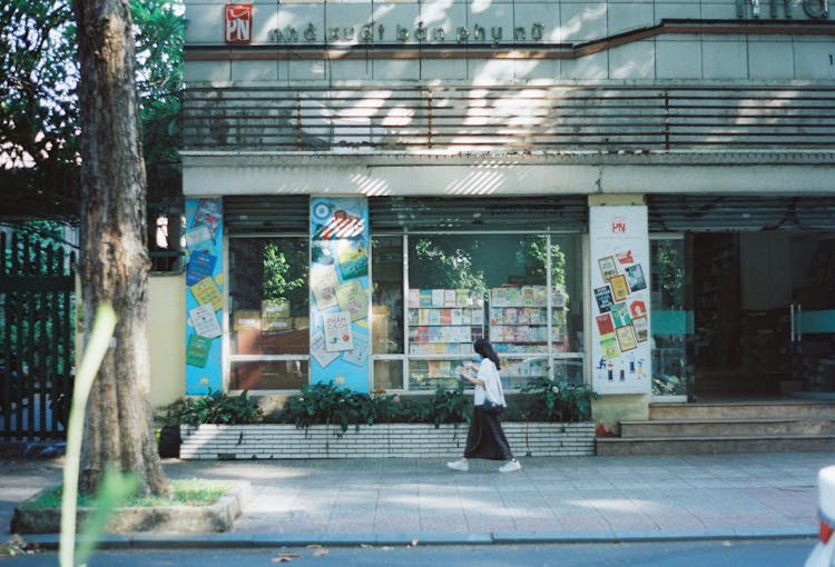 Woman With Face Mask Walking On Pavement