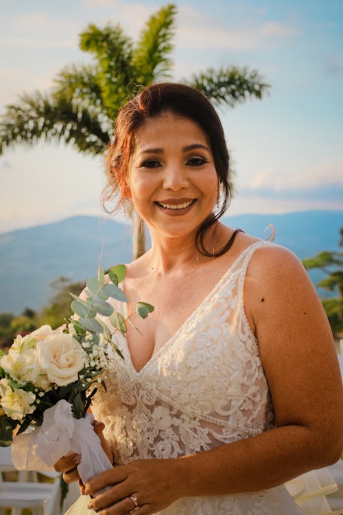 Smiling Bride with Flowers Bouquet