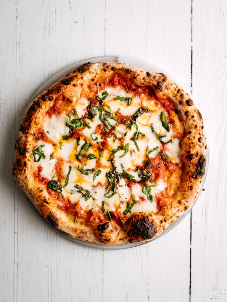 Pizza On A Wooden Table