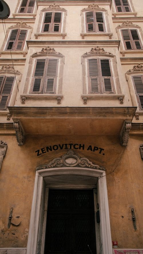 Free Vertical view of a classic European architecture showcasing the Zenovitch Apt facade. Stock Photo