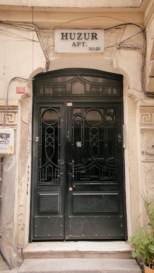 Free Elegant black wrought iron door of Huzur Apt in historic Istanbul setting. Stock Photo