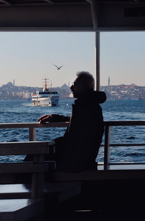 Man Sitting with Sea in Istanbul behind
