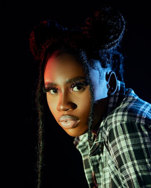 Studio Shot of a Young Woman in a Checkered Shirt 