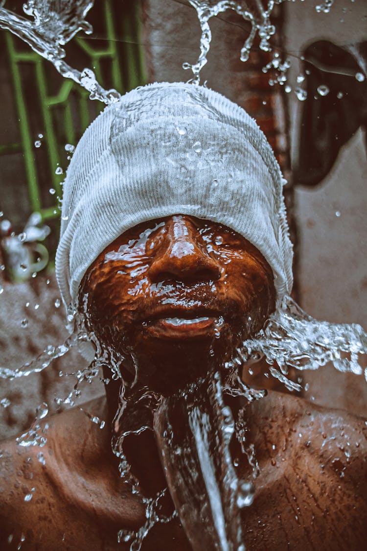 Water Splashing Around Man Face