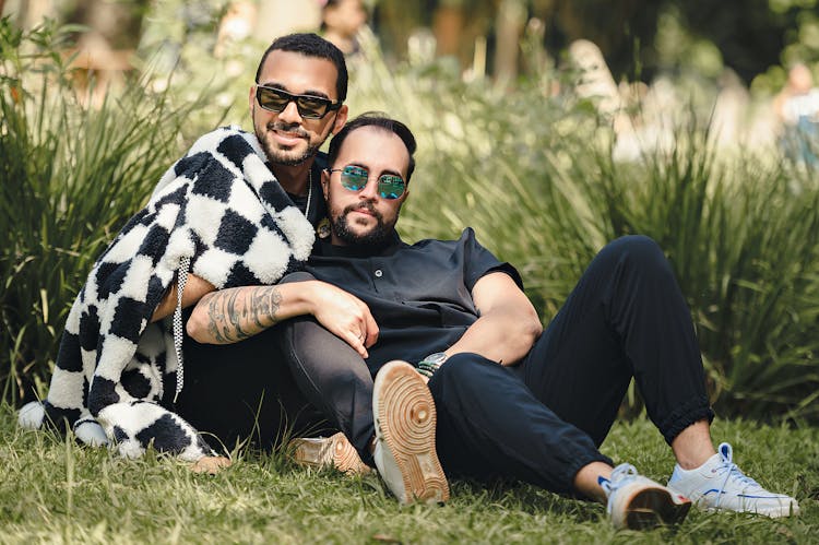 Couple Lying Down On Grass