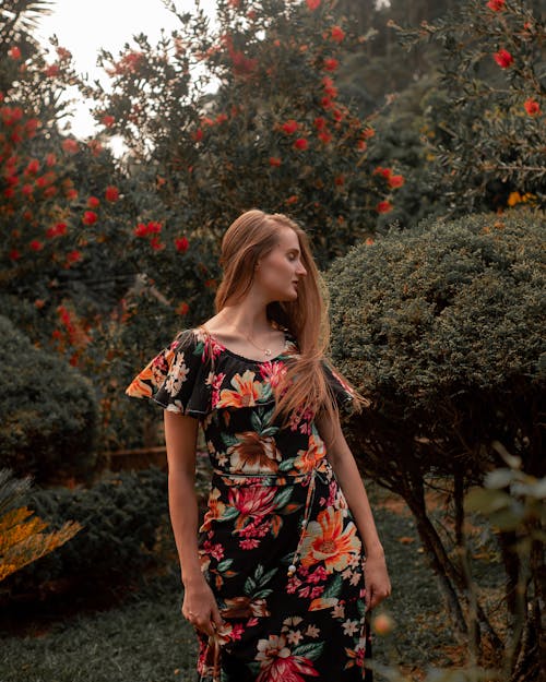 Blonde Woman Posing among Trees