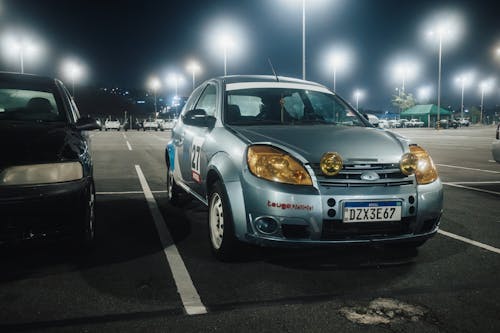 Silver Car with Yellow Headlights