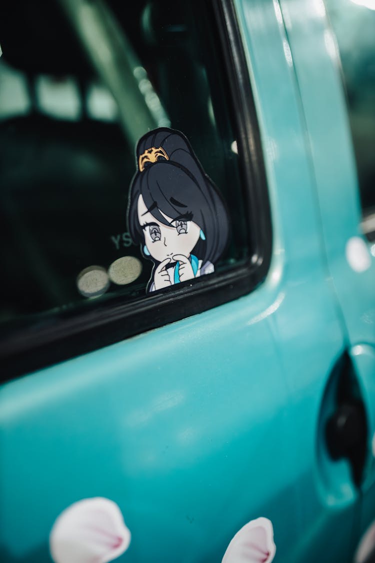 Close-up Of An Anime Sticker On A Car Window 