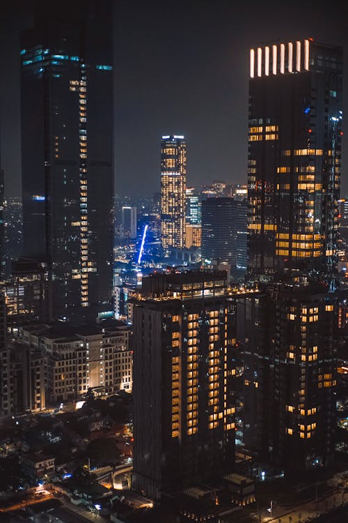 View of Modern Skyscrapers Illuminated at Night 