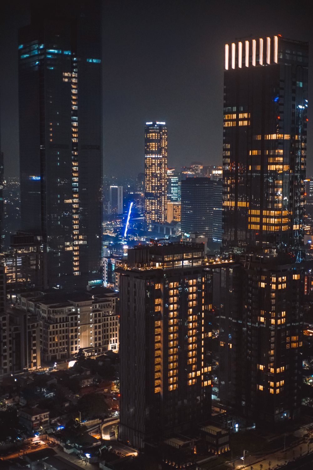 View of Modern Skyscrapers Illuminated at Night · Free Stock Photo