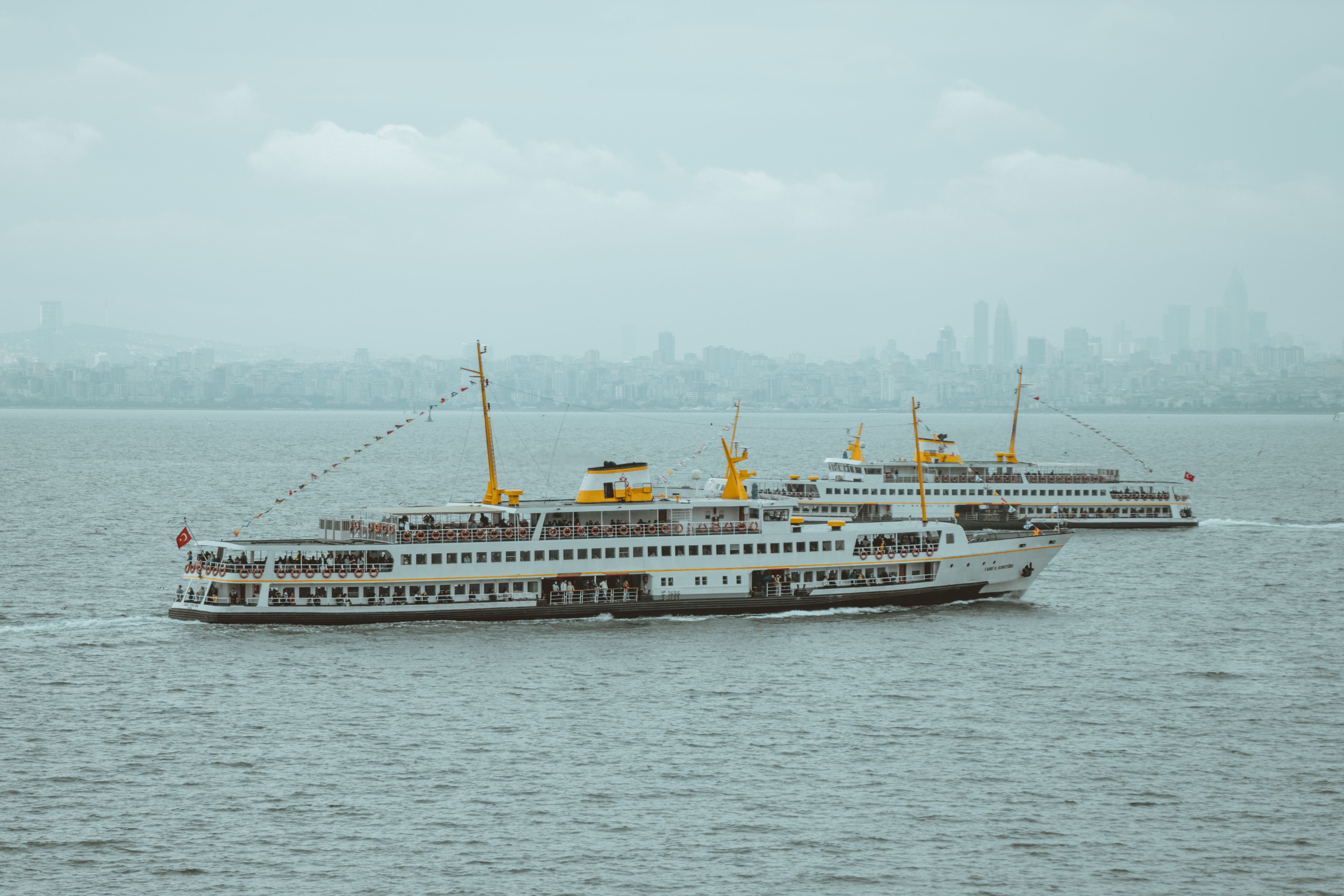 Two boats are traveling on the water · Free Stock Photo