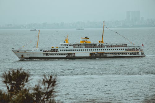 View of a Passenger Ship on the Bosporus with City Skyline in the Background 